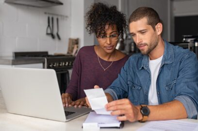 a couple reviewing financial statements at home