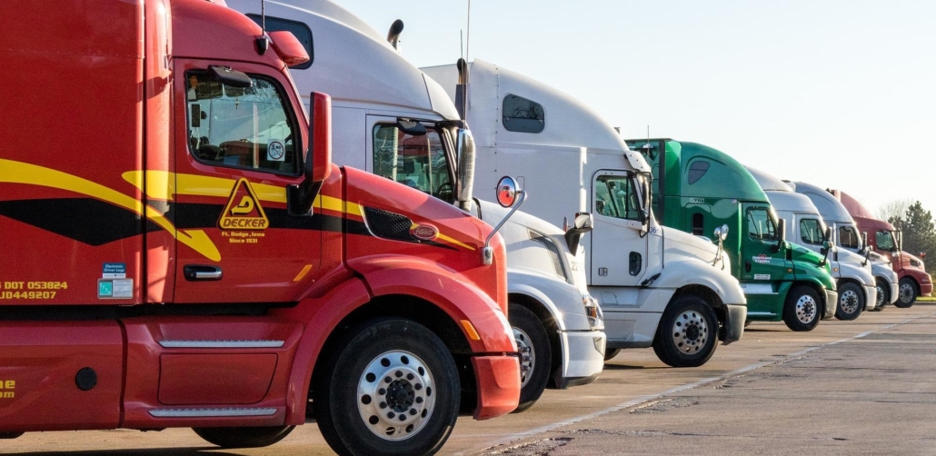 a line of semi trucks parked