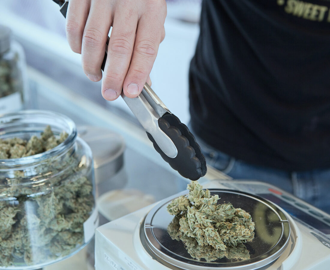 cannabis being weighed at a dispensary