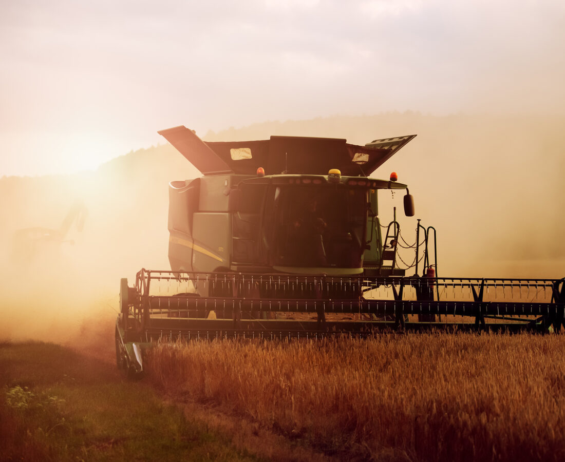 a farmer harvesting his field