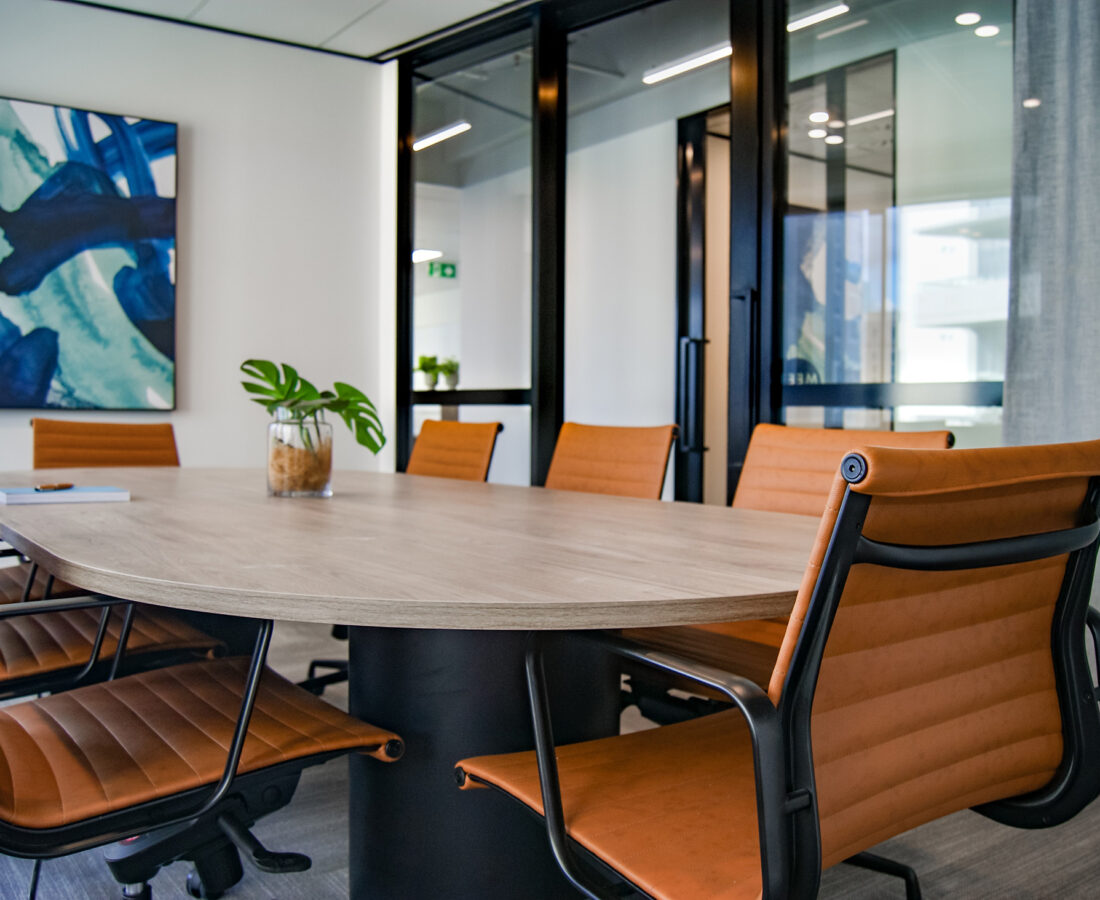 a conference table inside of a business office