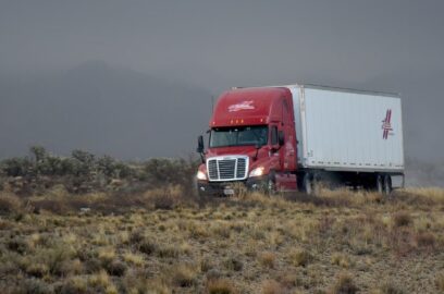 a semi truck driving on a highway
