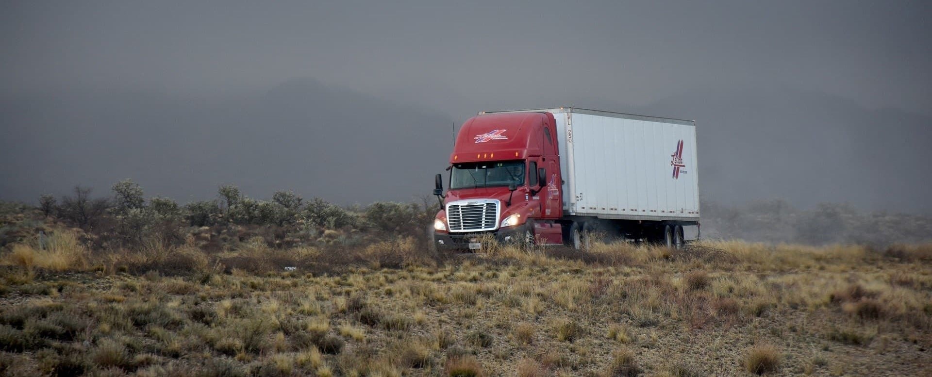 a semi truck driving on a highway