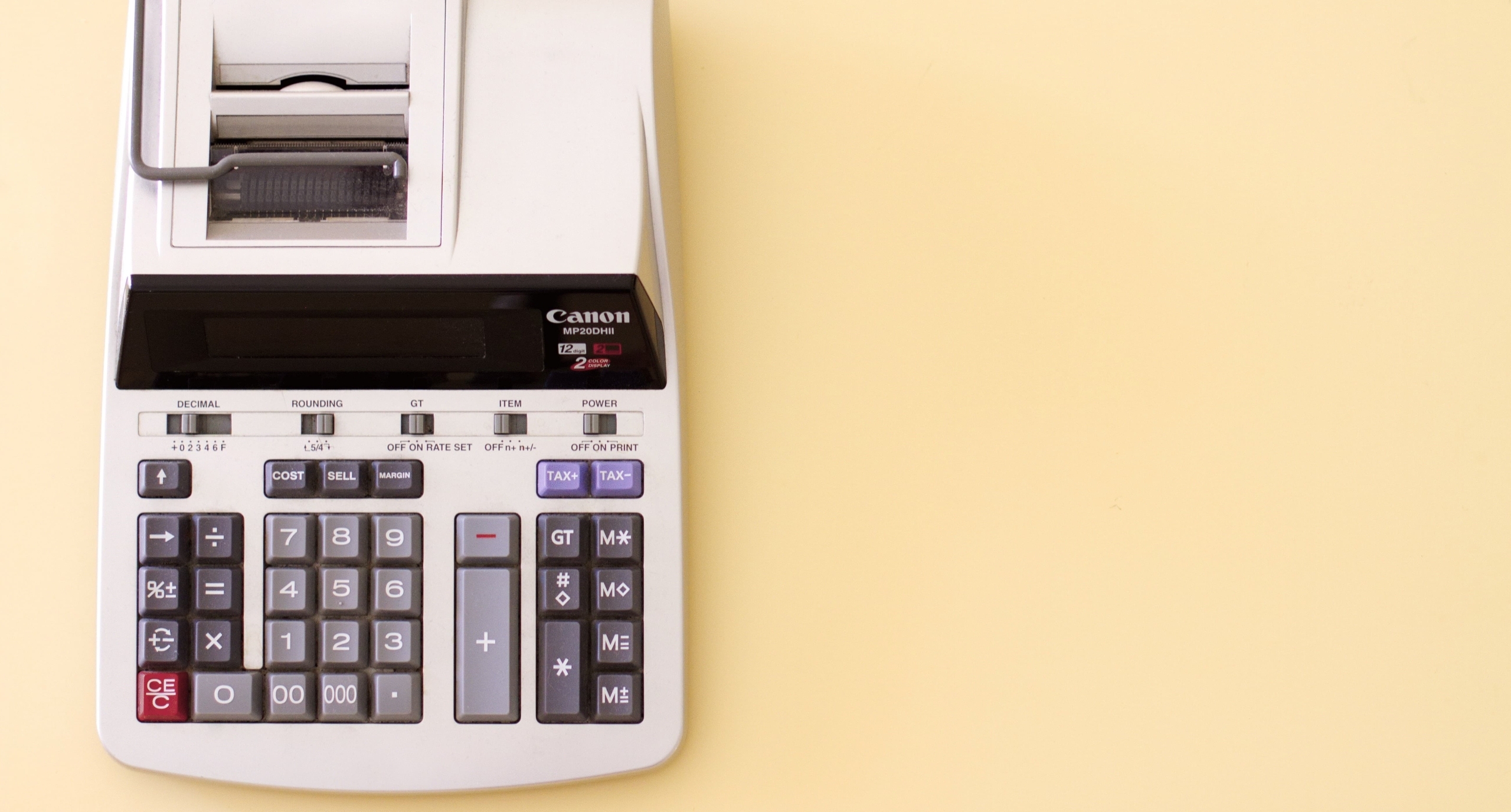 a calculator with a paper roll