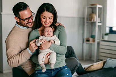 Parents and their child in a bedroom