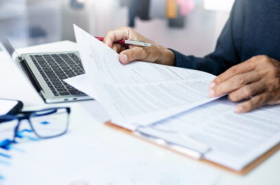 Business owner reviewing financial documents and building equity plan,
