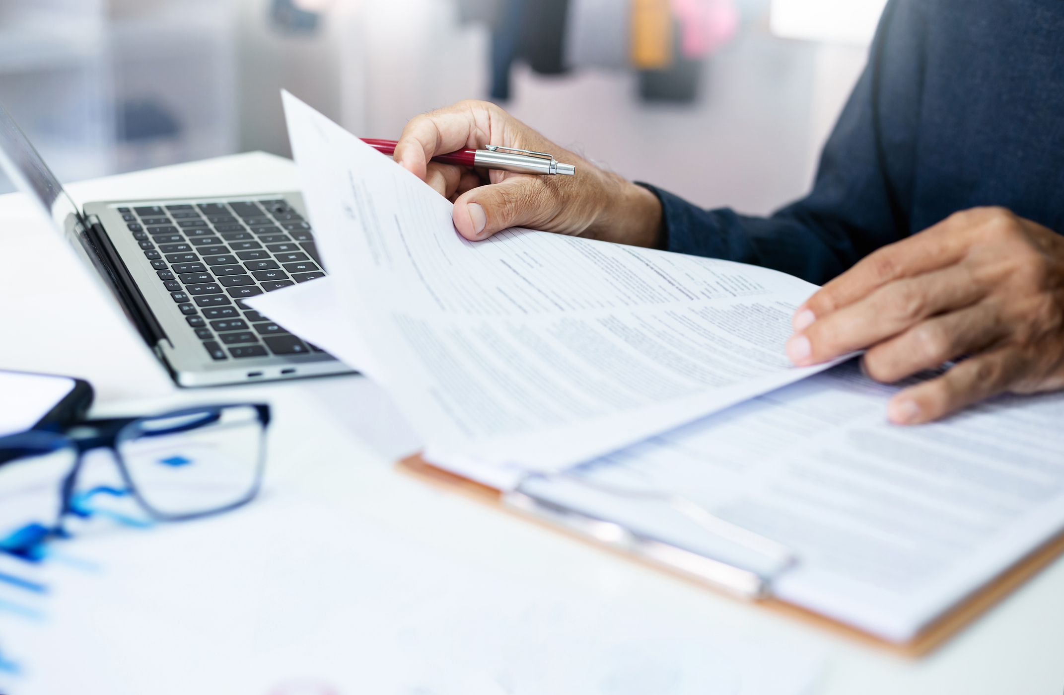 Business owner reviewing financial documents and building equity plan,