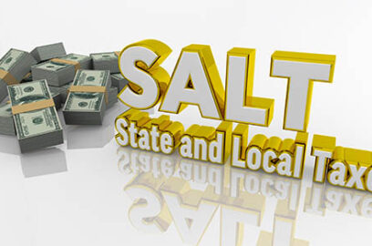 Graphic with the words SALT and State and Local Taxes bolded next to a pile of cash.