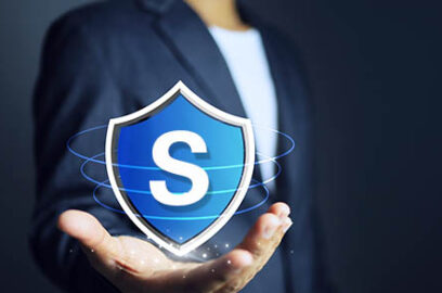 Businessman holding a shield in his hand to mean protecting data or assets from damage or theft or cyber threats