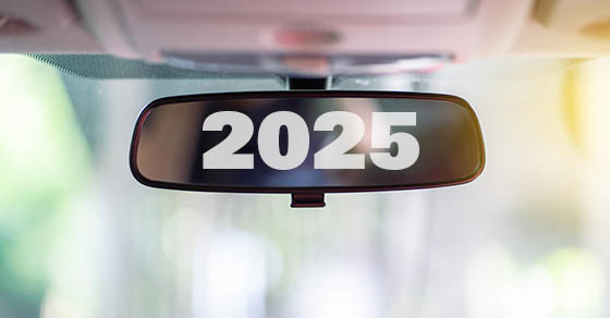 Car rear view mirror inside the car that says 2025.