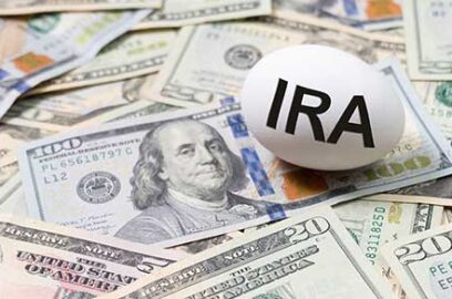 Dollar bills, spread out, nest egg, text IRA,