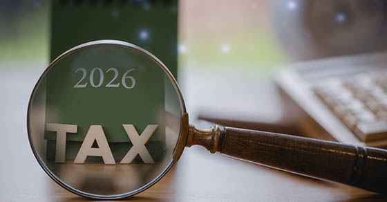 2026,Tax,Concept,With,Magnifying,Glass,Highlighting,Tax,On,A
