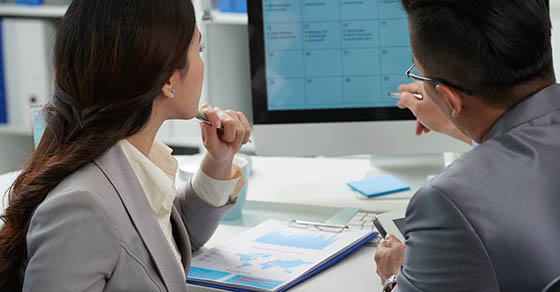 Business,People,Discussing,Calender,Of,Upcoming,Month