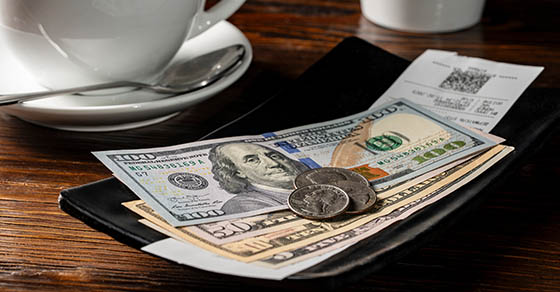 American,Money,In,A,Tip,Tray,When,Paying,A,Bill