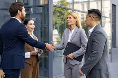 Interracial,Group,Of,Young,Business,People,Standing,On,Street,Outside