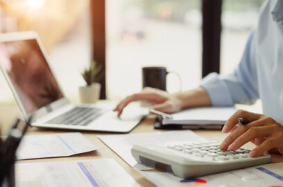 Businessman, calculating, finances, at, office, desk. Concepts, of, finance, management