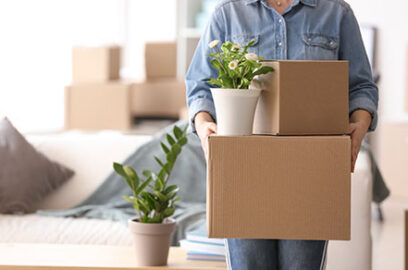 Person, holding, boxes, boxes, in, background, moving