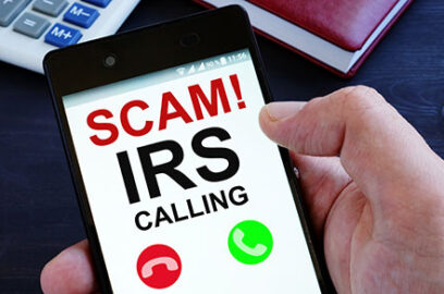 Hand, holding, cell phone, screen, text, words, Scam, IRS, Calling