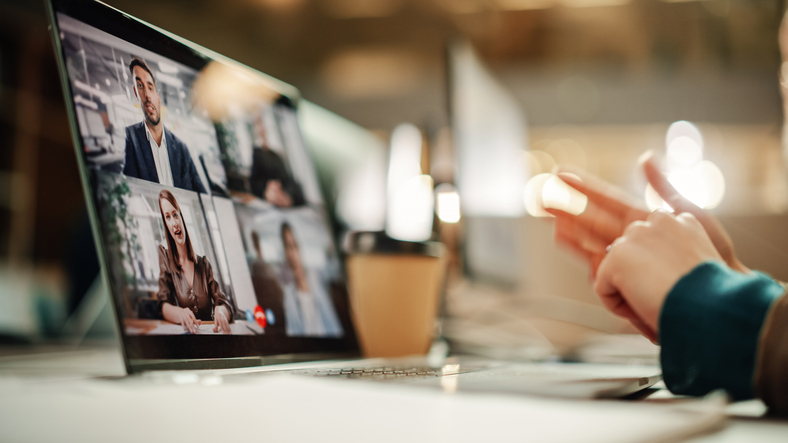Close-up of laptop screen featuring group video call