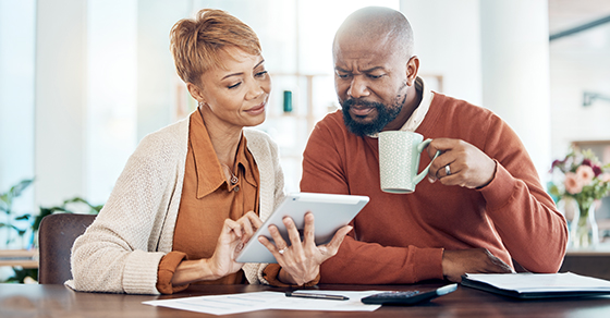 Review, Social Security, Benefits, Man and Women, Sitting at Kitchen Table, Drinking Coffee,