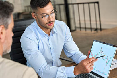 Financial,Advisor,Explaining,Invest,Stock,Market,Data,Consulting,Investor.,Two, busy business men, analysts, doing finance, trading analysis, pointing at exchange chart, on laptop screen, working in office.