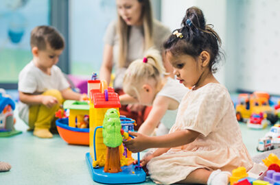 child daycare, chirdren playing, child building blocks, day care supervisor