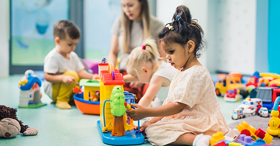 child daycare, chirdren playing, child building blocks, day care supervisor