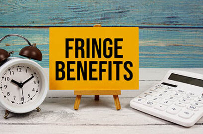 Fringe,Benefits,Text,Written,On,Paper,Card,With,Calculator,And alarm clock, on wooden background