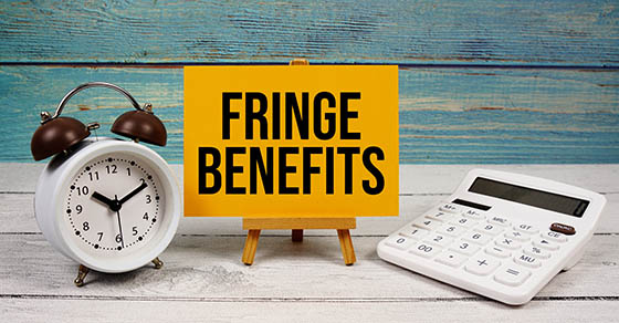 Fringe,Benefits,Text,Written,On,Paper,Card,With,Calculator,And alarm clock, on wooden background
