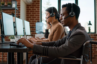 Customer, service, desk, two employees, sitting in front of their computers