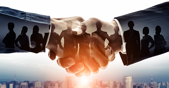 Handshake, two businessmen, overlay photo of team, standing together, team, unity,