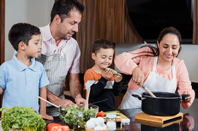 Family, in the kitchen, Mom, Dad, Son, Daughter, making dinner.